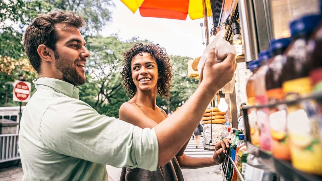 grow your business by engaging your customers - couple in front of store